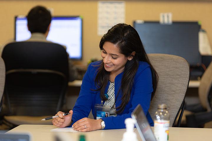 Resident writing on a piece of paper