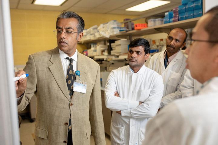 Physician working with residents in the Interventional Radiology Residency