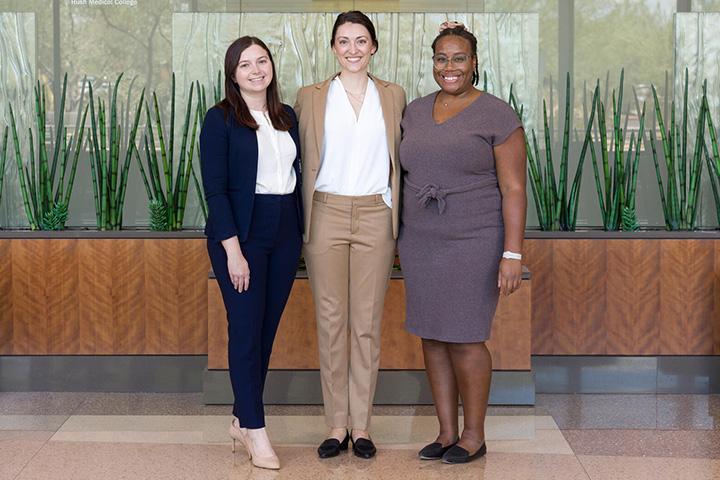 Three minimally invasive gynecologic surgery fellows