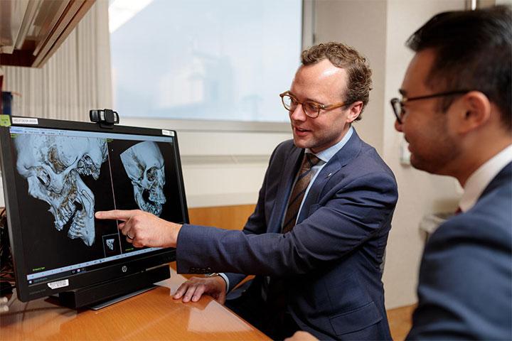 Mayo Clinic Oral and Maxillofacial residents discussing a case.