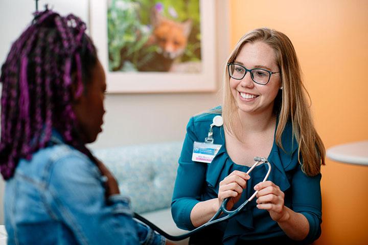Pediatric and Adolescent Medicine resident meets with a patient