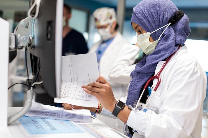 A pulmonary medicine physician reviews case information at Mayo Clinic