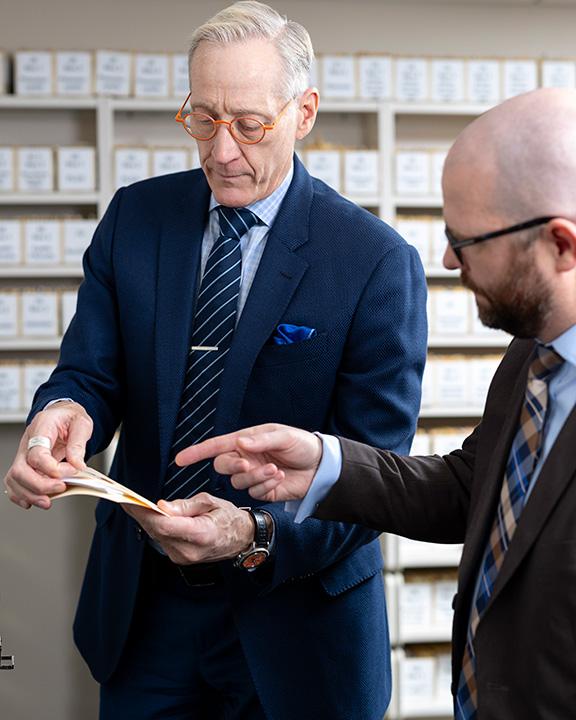 Two people from pulmonary pathology fellowship program in Arizona looking at files