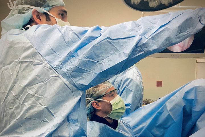 The chief resident acting as a teaching surgeon to the junior residents in the Urology Residency at Mayo Clinic in Jacksonville, Florida.