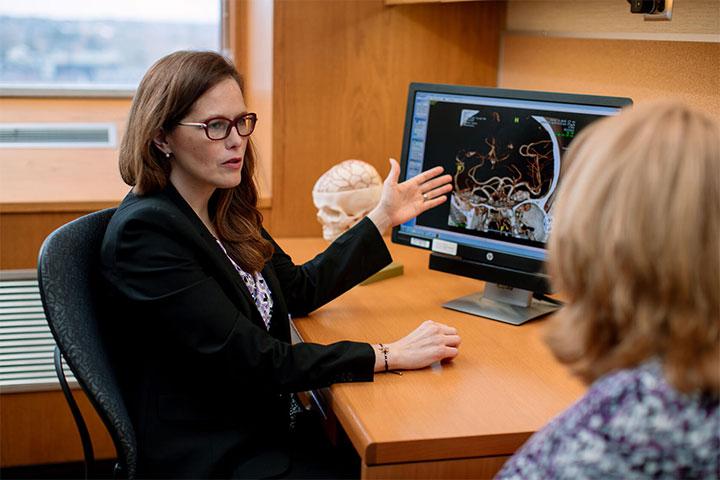 Kelly Flemming, M.D. speaks with a stroke patient at Mayo Clinic in Rochester, Minnesota.