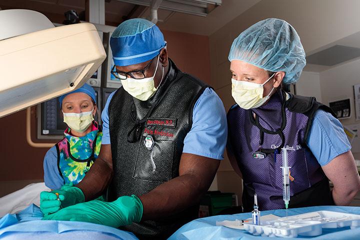 Mayo Clinic trainee completing a procedure with a faculty member