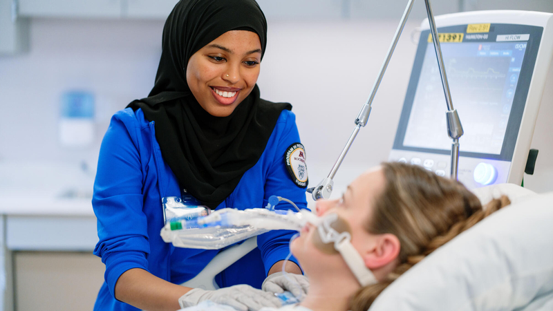 Respiratory Care technician with a patient.