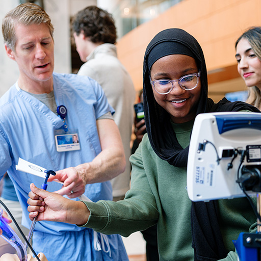 An attendee participates in a hands-on activity during the 2025 Mayo Clinic School of Health Sciences Open House for prospective students.